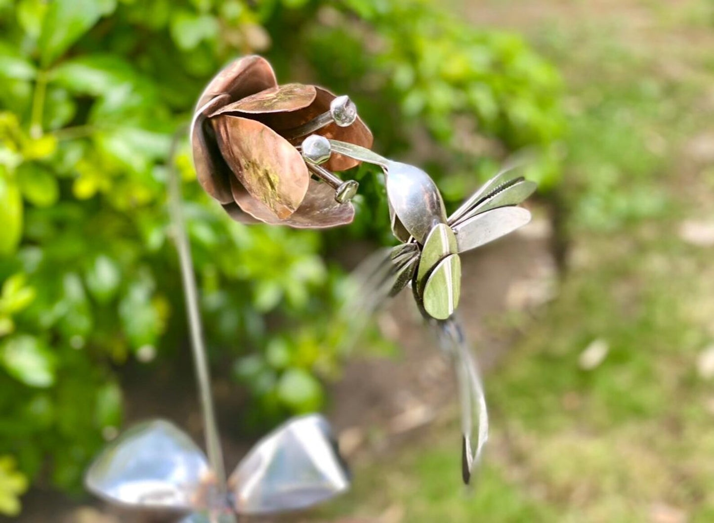 Hummingbird and flower sculpture